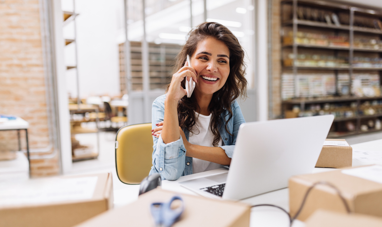 https://images.docjacket.com/blog-images/woman-on-phone-and-laptop-smile.jpg